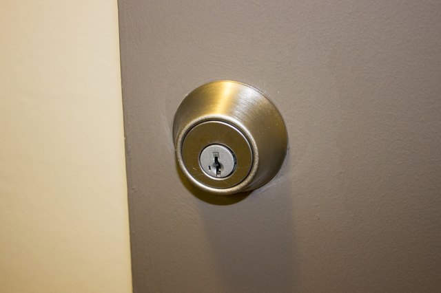 How to Remove a Schlage Deadbolt That Has No Visible Screw Heads